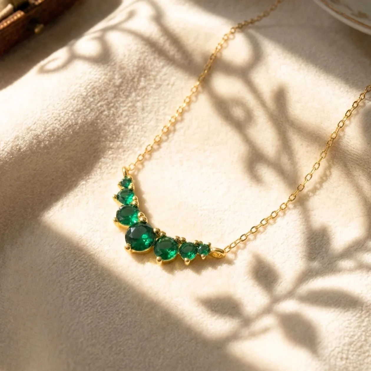 Graduated Round Emerald Stones Gold Plated Necklace: the shop's own photo