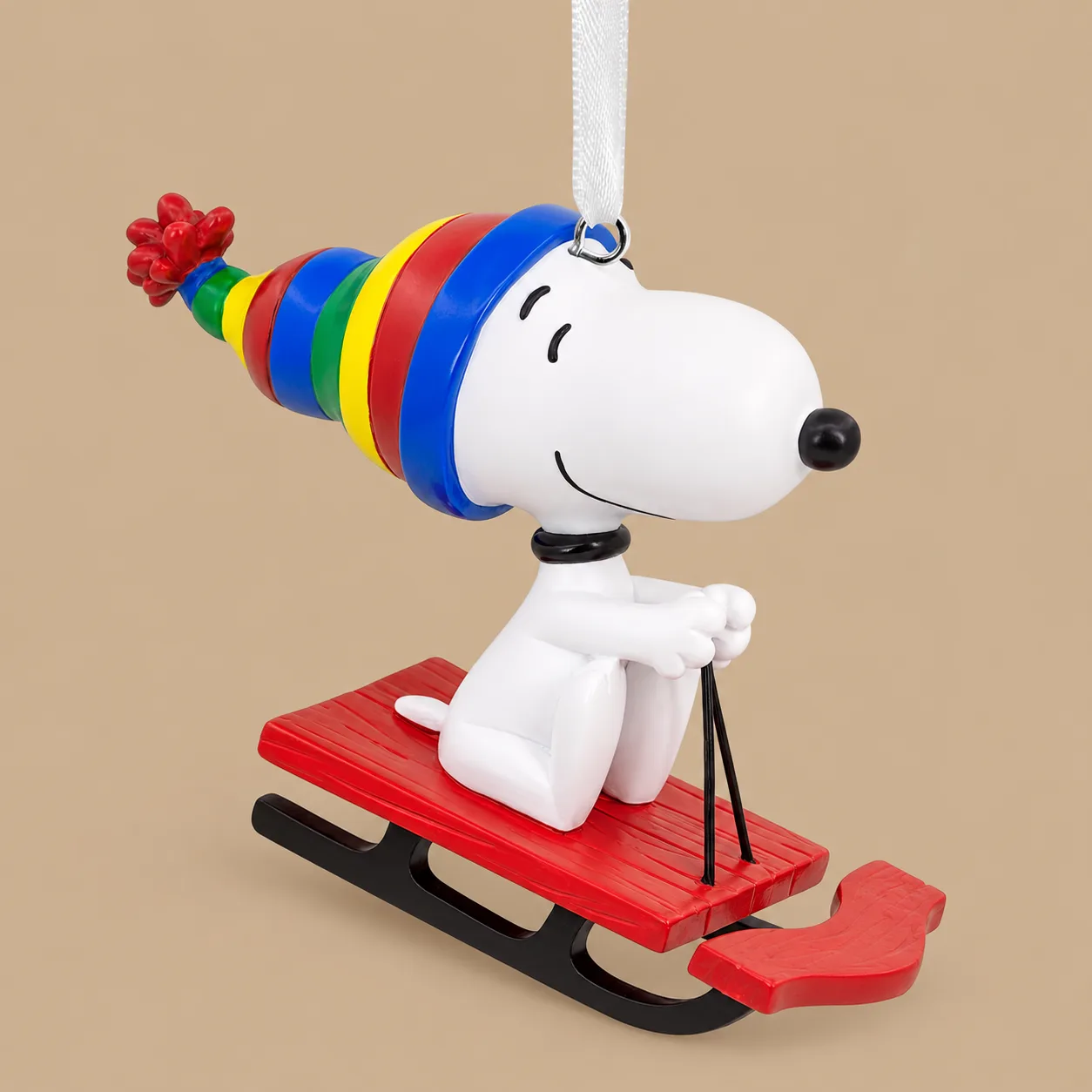 Hallmark Peanuts Snoopy on Sled Hanging Ornament: the shop's own photo