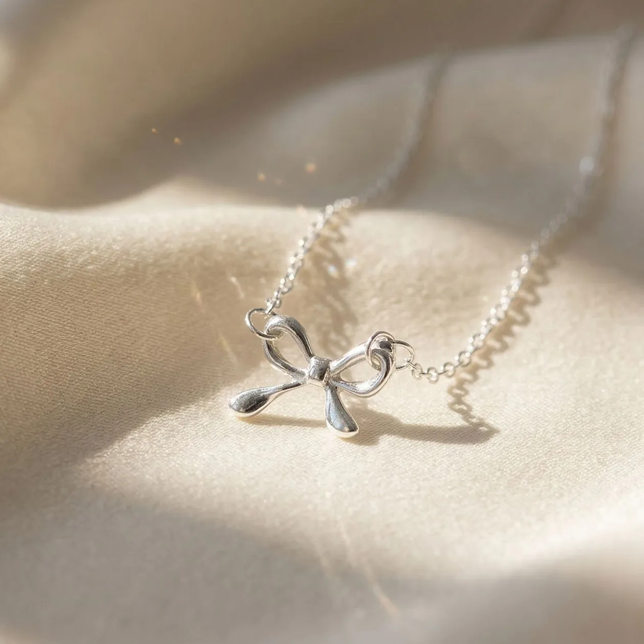 Tiny Small Bow Tie Ribbon Sterling Silver Necklace: the shop's own photo