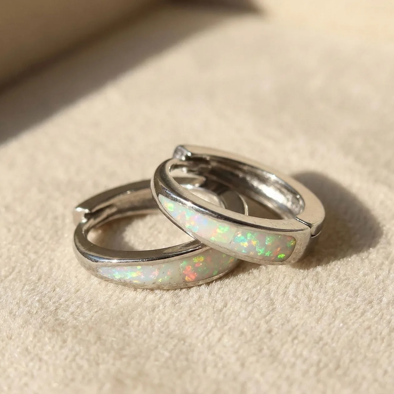 White Opal Tapered Sterling Silver Huggie Hoop Earrings: the shop's own photo