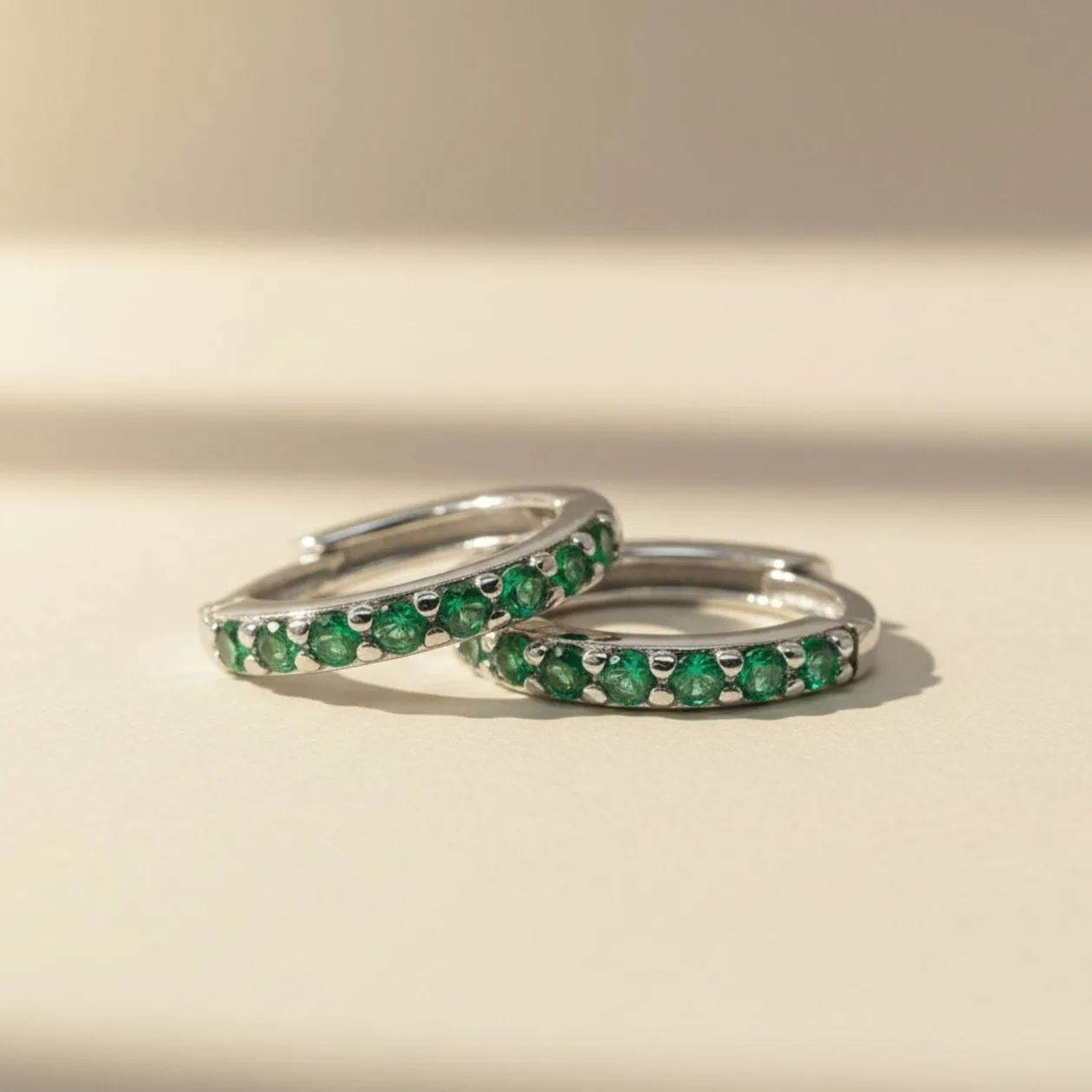 Emerald May Birthstone Small Silver Huggie Hoops: the shop's own photo