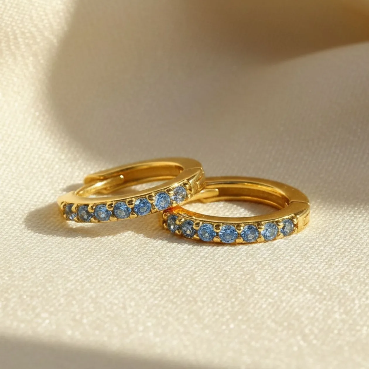 Blue Topaz December Birthstone Small Huggie Earrings: the shop's own photo