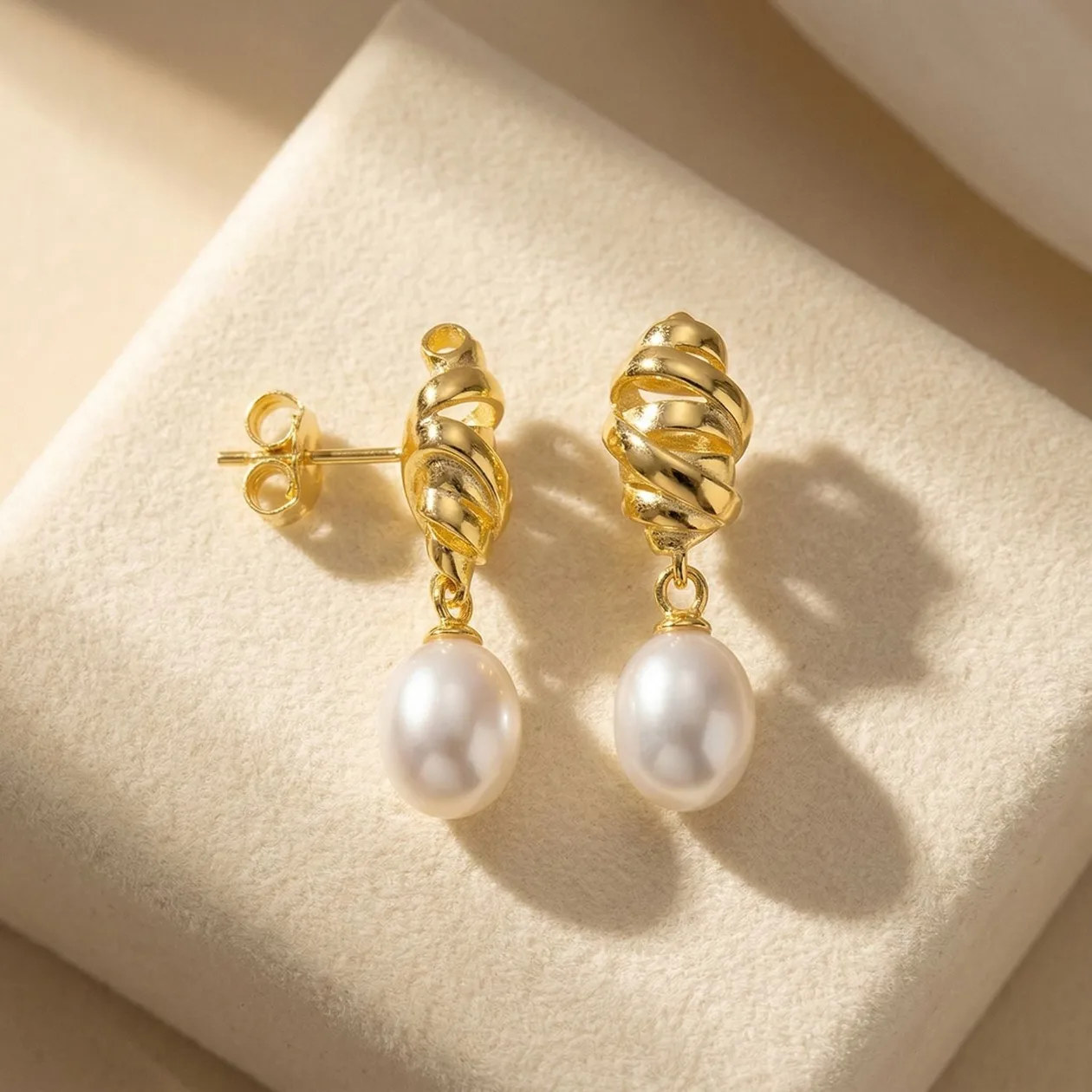 Gold Plated Minimalist Twisted Pearl Stud Earrings: the shop's own photo
