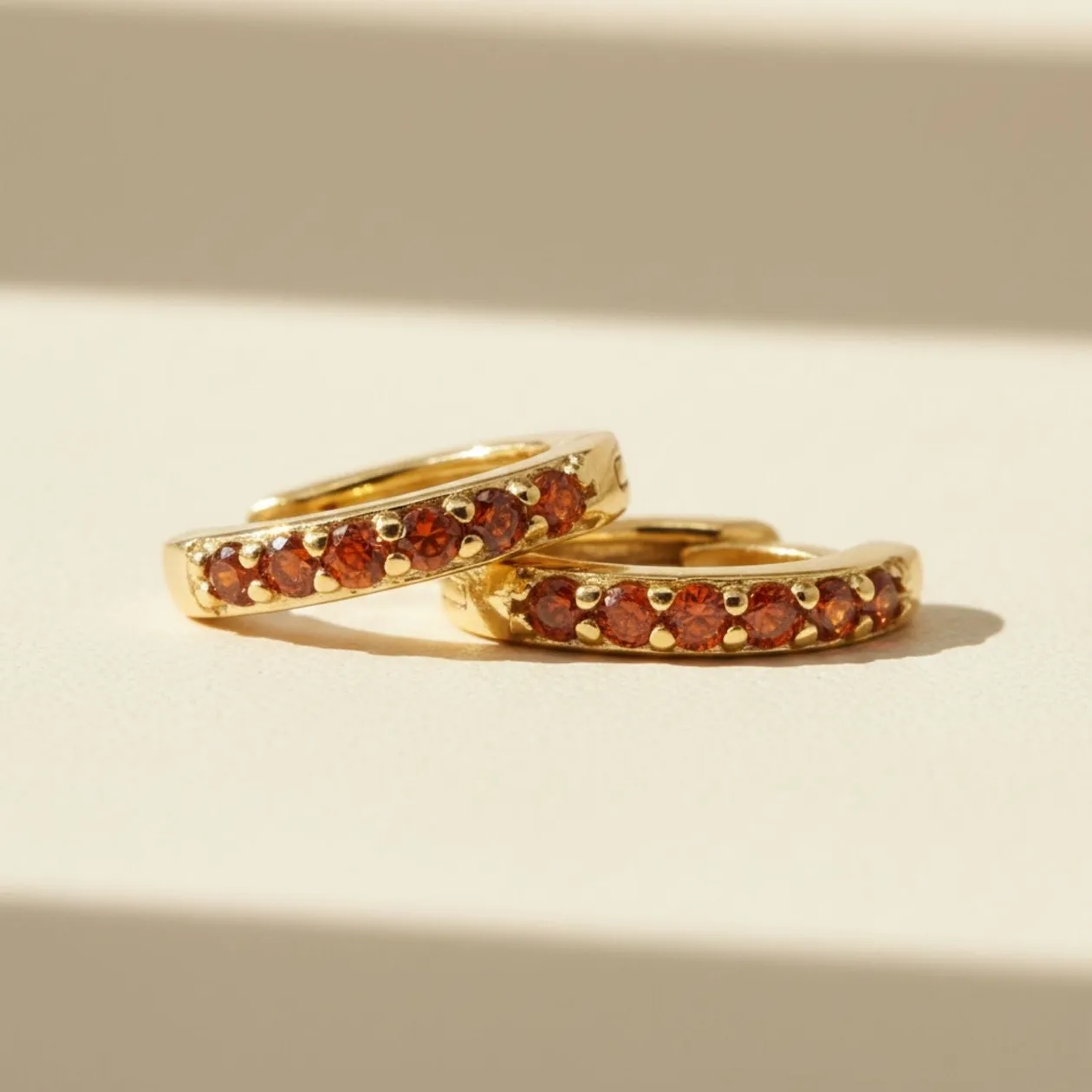 Garnet January Birthstone Small Huggie Gold Plated Hoop Earrings: the shop's own photo