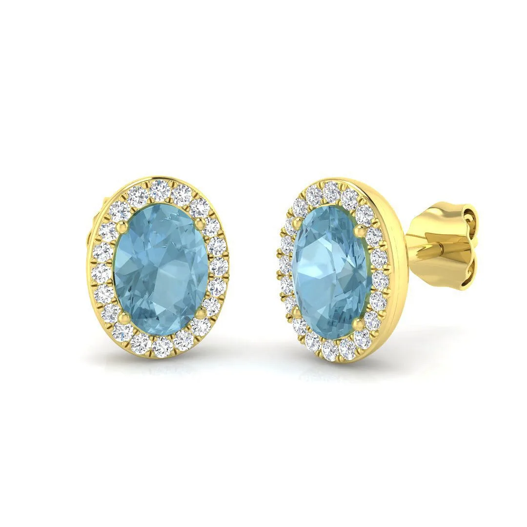 Sky Blue Topaz & Natural Diamond Halo Stud Earrings | 9K White, Yellow & Rose Gold - 9k Yellow Gold / Oval Cut: the shop's own photo