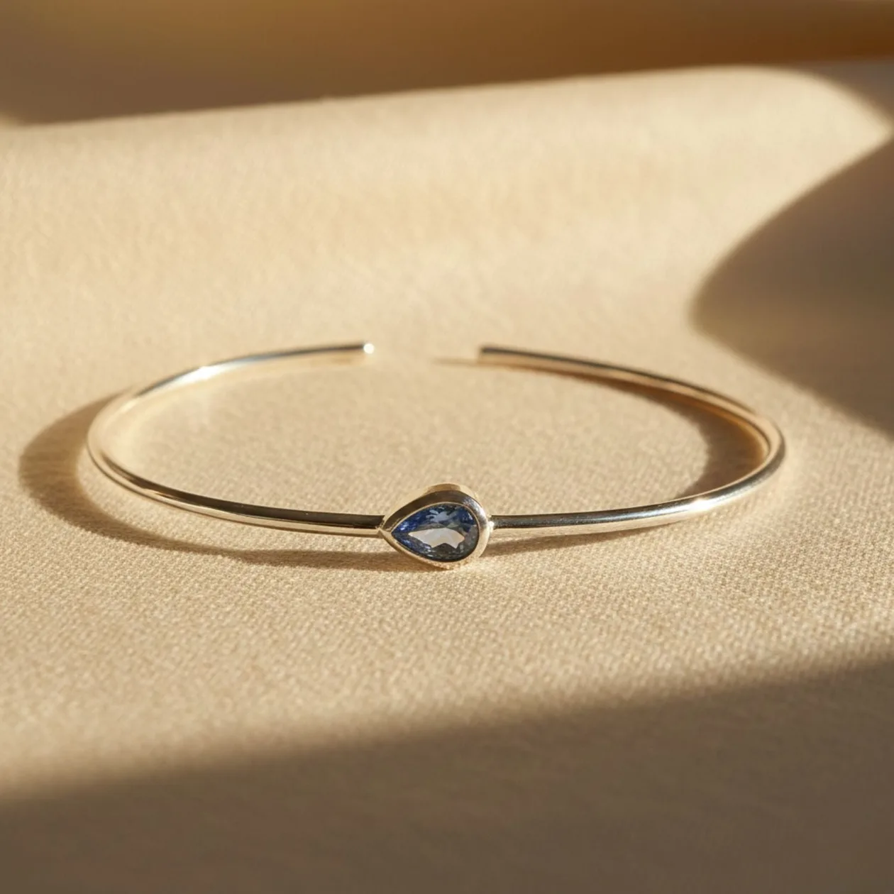 Minimalist Sterling Silver Blue Topaz December Birthstone Bangle Bracelet: the shop's own photo