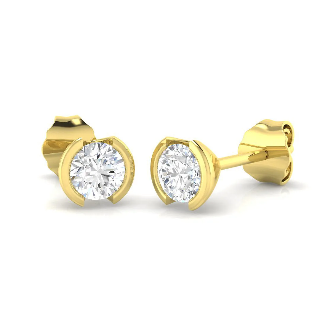 Stud Earrings with Round Diamond Tension Set - 1 Carat Platinum - 18k Yellow Gold / 0.20 Carat: the shop's own photo
