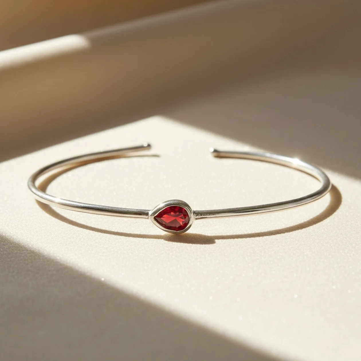 Minimalist Sterling Silver Garnet January Birthstone Bangle Bracelet: the shop's own photo